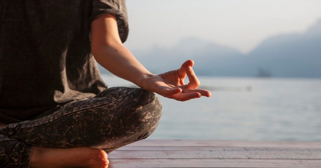 women practicing yoga