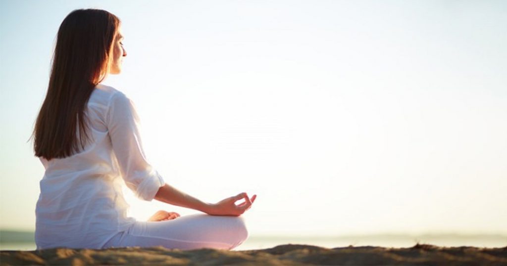 yoga poses of women in beach